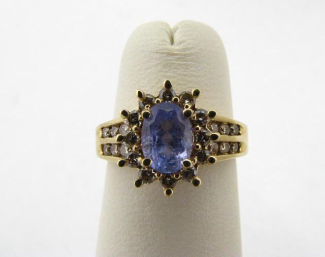 Appraisal: K yellow gold ring with oval tanzanite center stone and