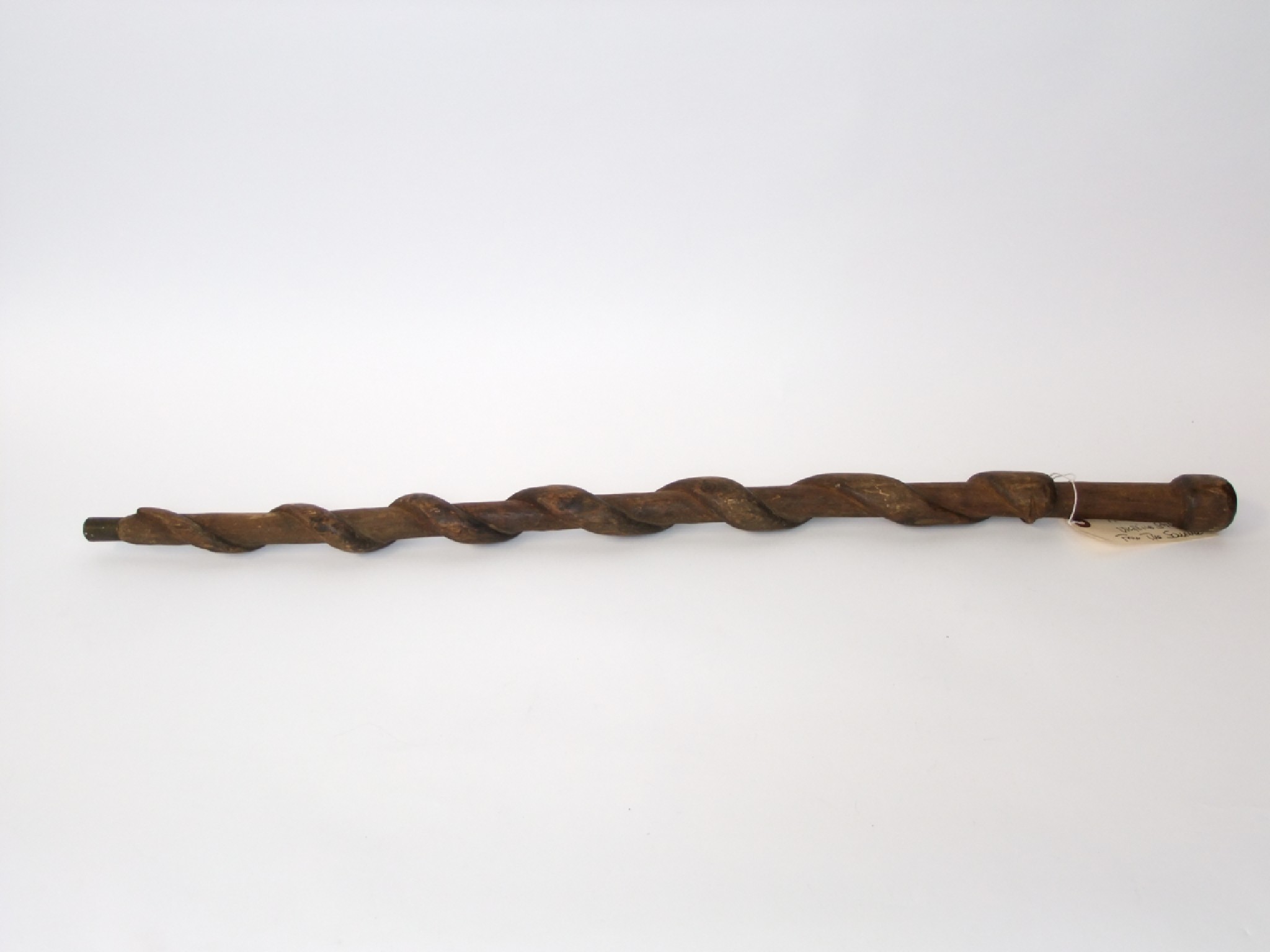 Appraisal: A rustic carved timber stick detailed with a clambering serpent