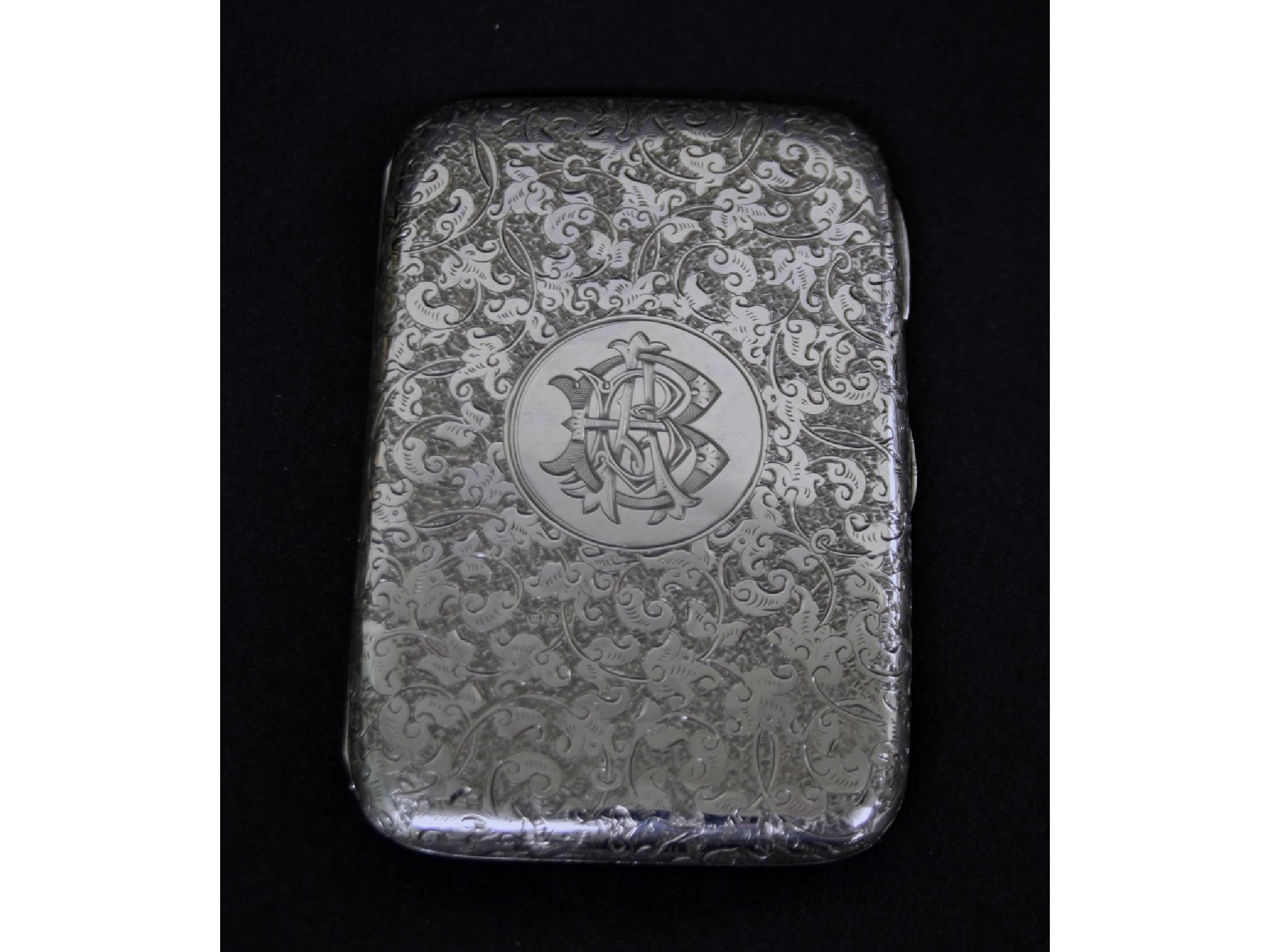 Appraisal: Attractive Victorian silver purse engraved with scrolled foliage and with