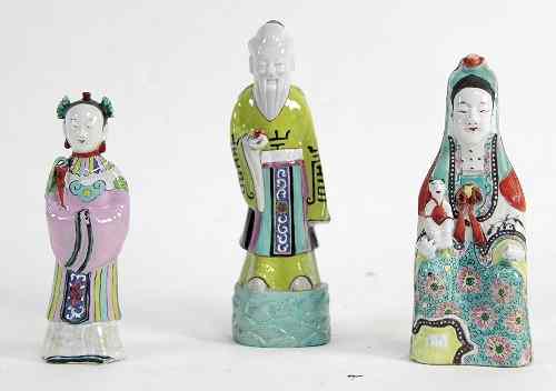 Appraisal: Three Chinese famille rose enamelled temple figures cm high and