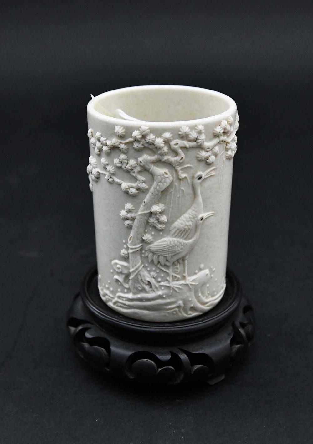 Appraisal: CHINESE CREAM GLAZED PORCELAIN BRUSH POTThe cylindrical vessel with an