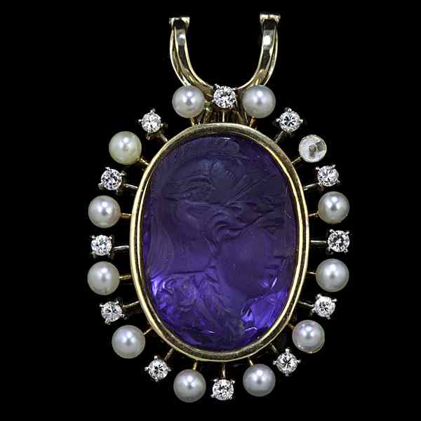 Appraisal: k Carved Amethyst Pendant k yellow gold carved amethyst diamond