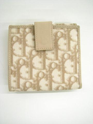 Appraisal: Christian Dior Paris tan and white classic monogram bi-fold wallet