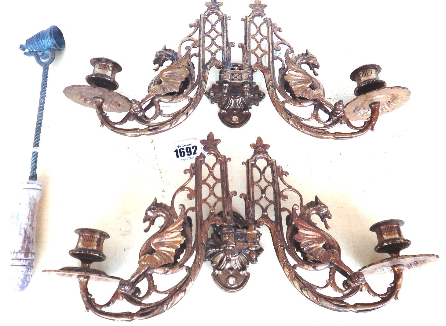 Appraisal: A pair of Victorian gilt brass twin light wall appliques