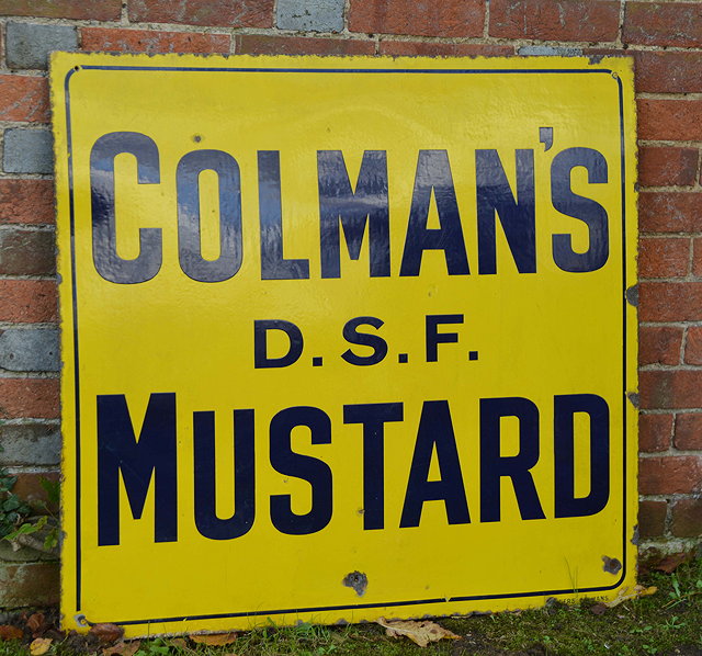 Appraisal: A LARGE EARLY TH CENTURY COLEMANS DSF MUSTARD YELLOW ENAMEL