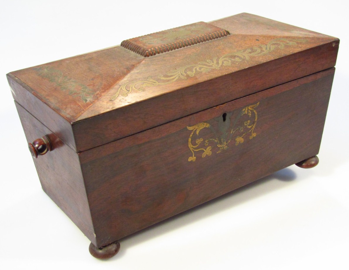 Appraisal: A Regency rosewood and ormolu mounted tea caddy the sarcophagus