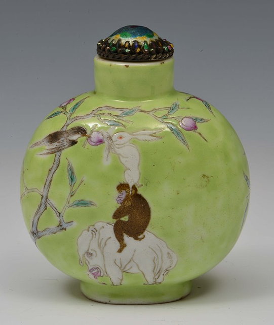 Appraisal: A CHINESE GREEN PORCELAIN SNUFF BOTTLE painted in enamels with