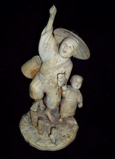 Appraisal: An ivory okimono Meiji period modelled as a fisherman with