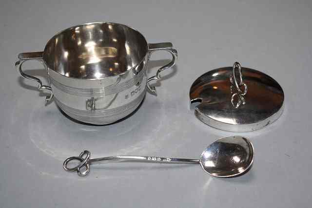 Appraisal: AN EDWARDIAN SILVER PORRINGER with reeded decoration and double 'C'