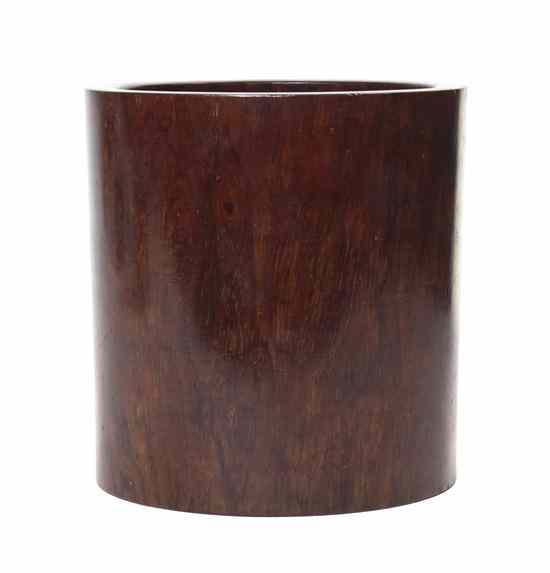 Appraisal: A Huanghuali Brushpot the heavily figured grain of dark tones