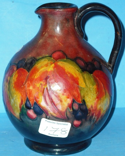 Appraisal: Moorcroft Flambe Jug decorated in the Leaf Berry design height