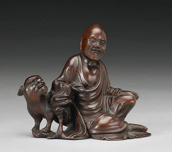 Appraisal: A carved dark wood figure of a luohan th Century