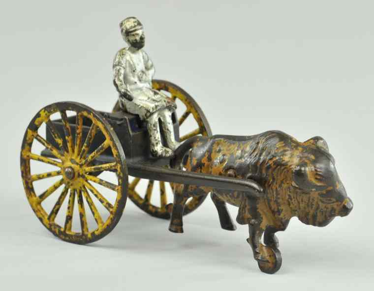 Appraisal: KENTON EGYPTIAN WILD BOAR CART Kenton scarce toy open cart