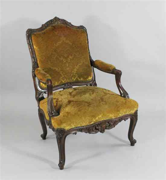 Appraisal: A French Louis XV design carved and stained beech fauteuil