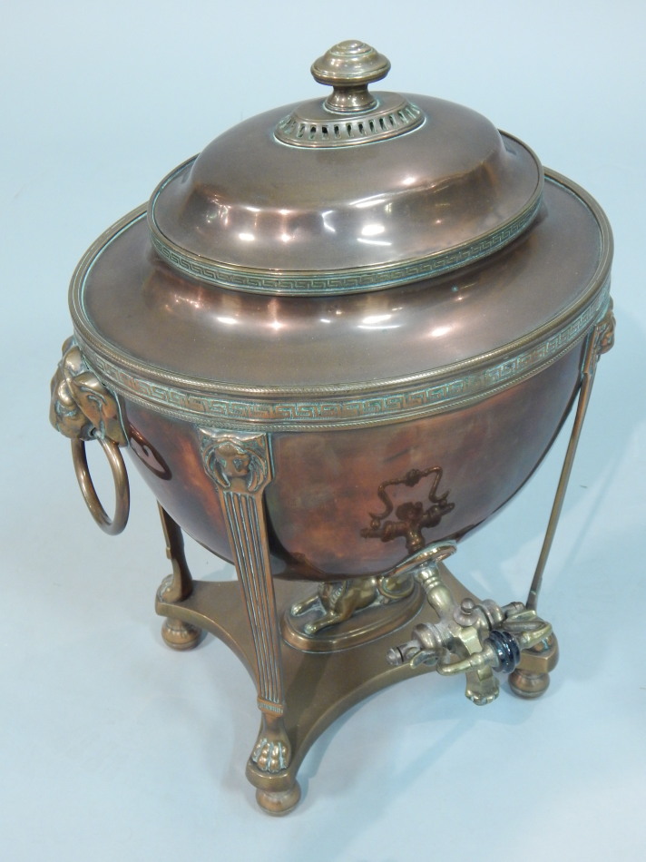 Appraisal: A George IV brass and copper tea urn in Egyptian