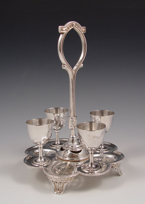 Appraisal: SILVERPLATE EGG CUP STAND egg cups on posts and reticulated