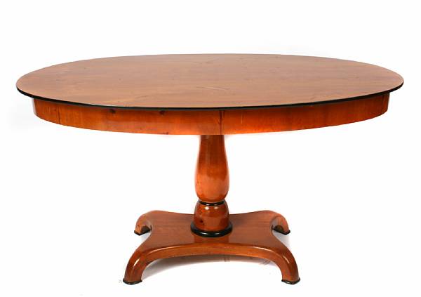 Appraisal: A Biedermeier style parcel ebony and birch oval center table