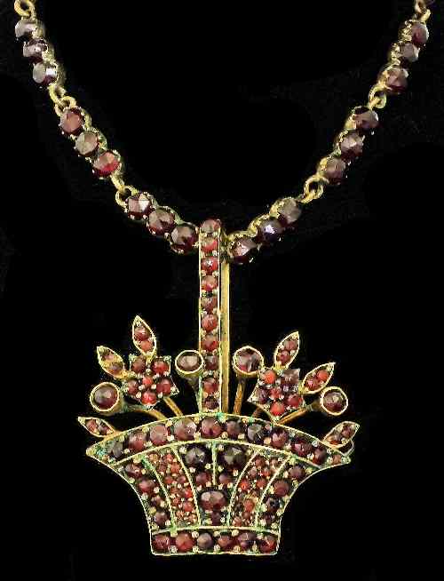 Appraisal: A Victorian gold coloured metal and all garnet set necklace