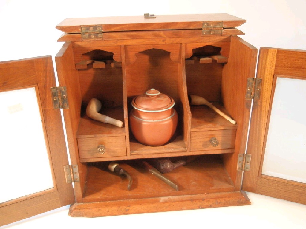 Appraisal: An Edwardian oak smokers cabinet