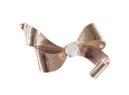 Appraisal: Retro opal and gold bow brooch K rose and yellow