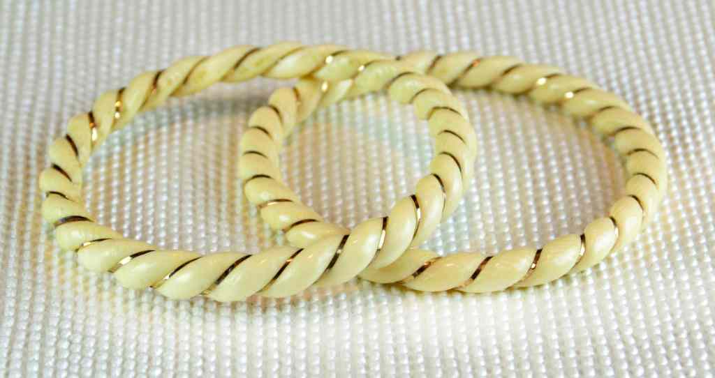 Appraisal: Chinese Ivory And Gold Thread Bangle BraceletsBoth carved in cable