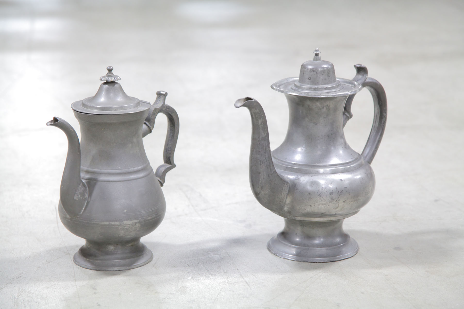 Appraisal: TWO PEWTER COFFEE POTS American th century One is marked