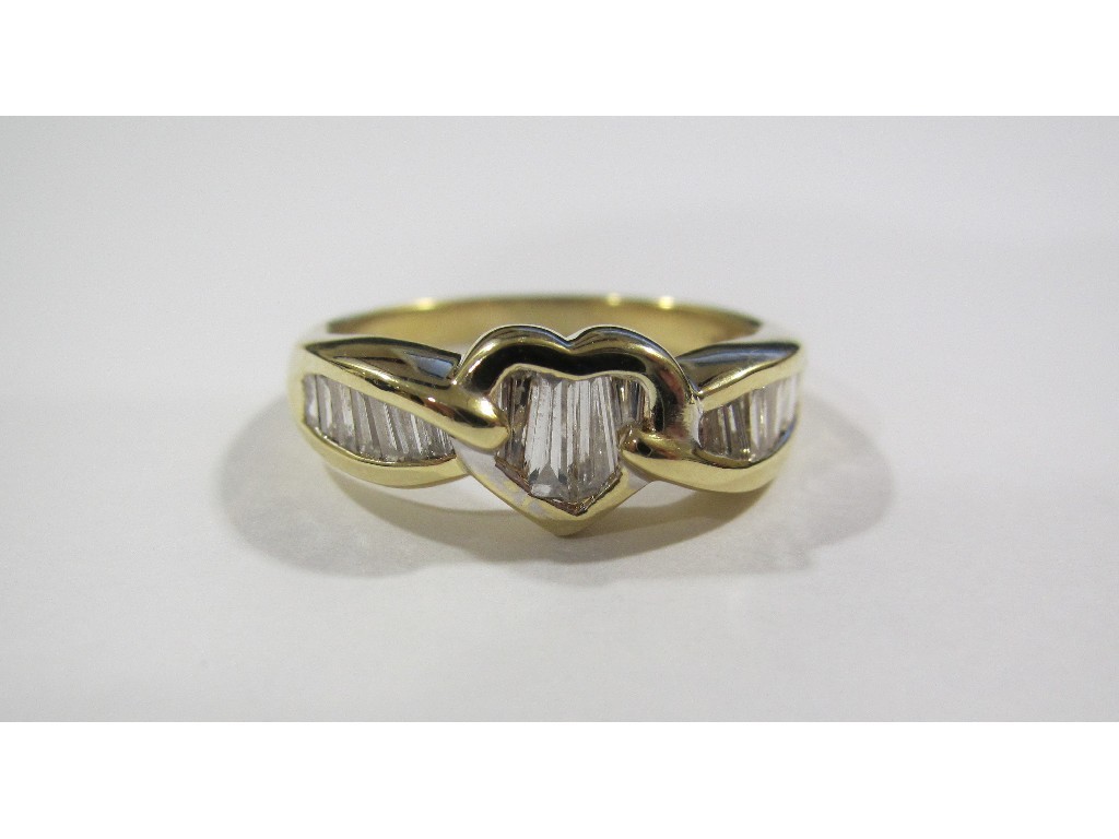 Appraisal: Eighteen carat gold diamond set dress ring with baguette cut