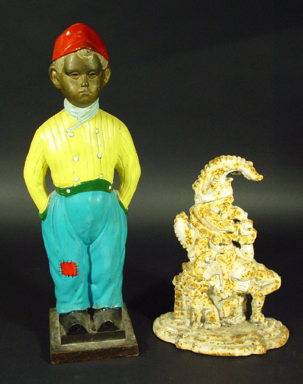 Appraisal: Two cast iron doorstops one modelled as Mr Punch the