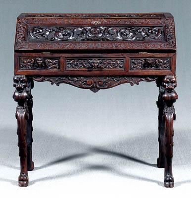 Appraisal: Renaissance Revival desk elaborate carving overall fallboard with stylized dragons