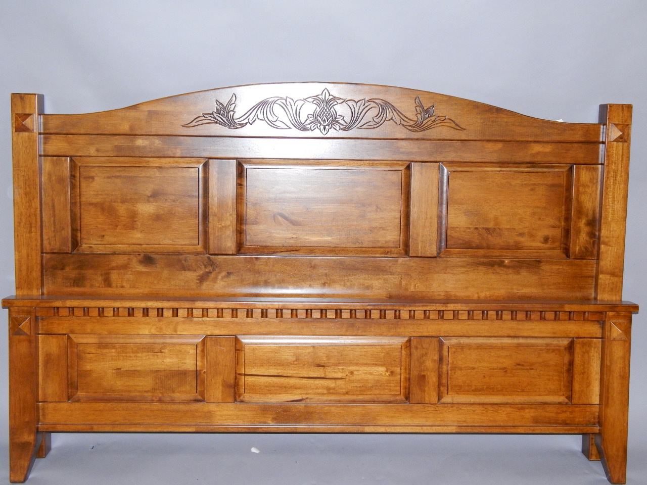 Appraisal: An oak double bed with a double headboard