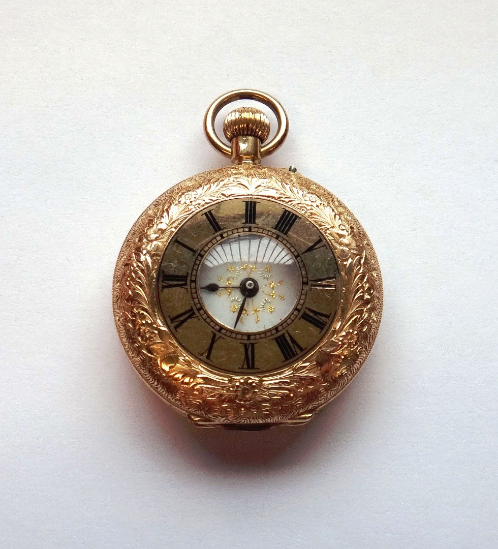 Appraisal: A ladies gold cased keyless wind half hunting cased fob