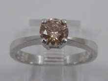 Appraisal: A white metal tests ct gold diamond solitaire ring the