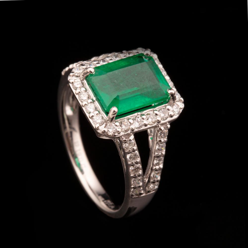 Appraisal: Platinum Emerald and Diamond Ring center octagonal step-cut emerald wt