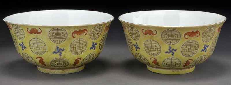 Appraisal: Pr Chinese Qing Xuantong yellow porcelain bowlsdepicting bats Greek keys