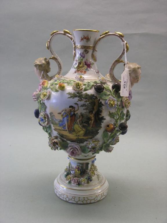 Appraisal: A th century German porcelain vase encrusted throughout with coloured