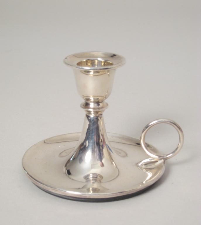 Appraisal: An Edward VII small circular Chamber Candlestick with loop handle