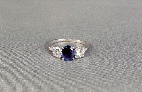 Appraisal: Platinum diamond and blue sapphire ring the oval cut sapphire