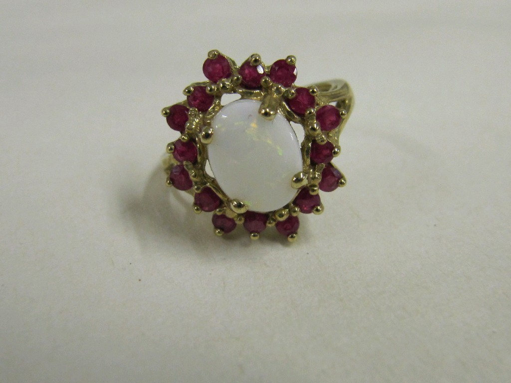 Appraisal: Nine carat gold opal and ruby cluster ring