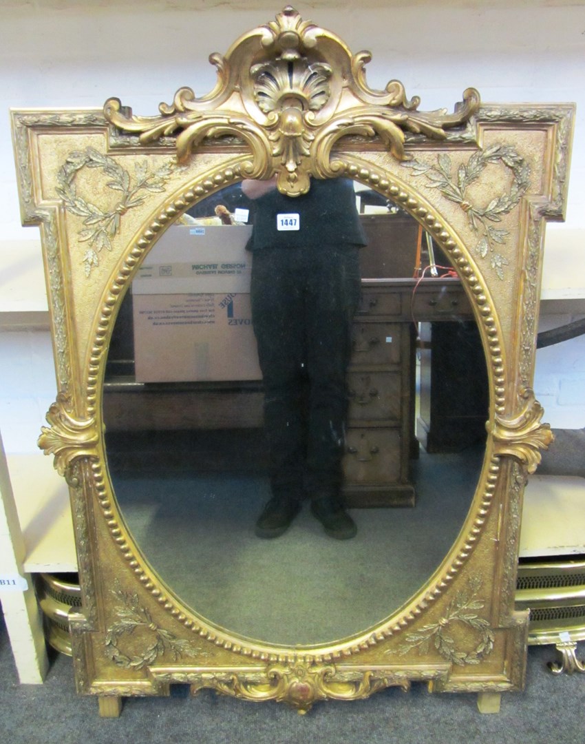 Appraisal: A th century gilt framed oval wall mirror with cartouche