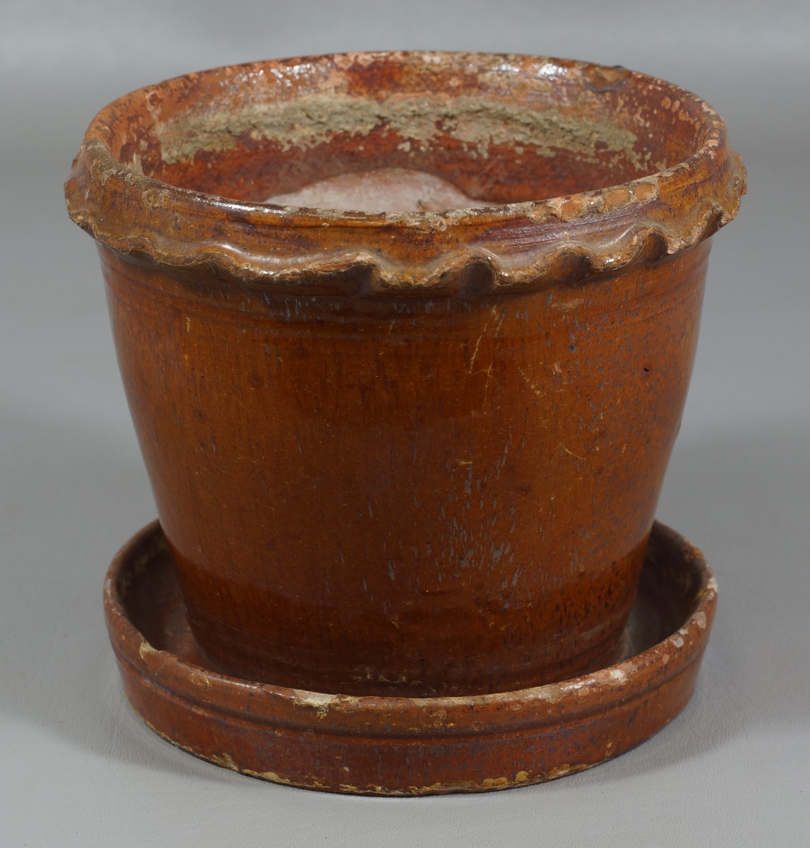 Appraisal: Pennsylvania glazed Redware flower pot with crimped rim an connected