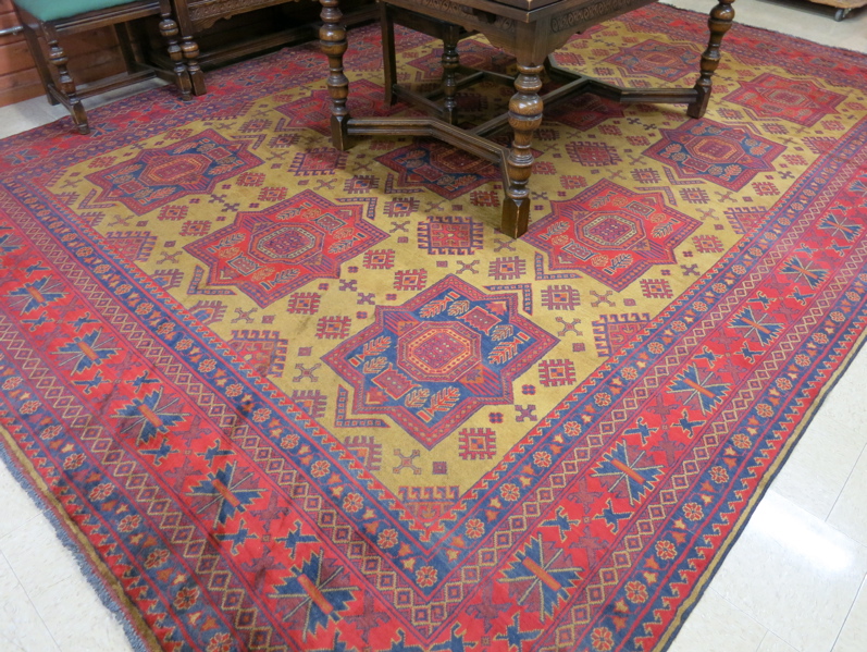 Appraisal: HAND KNOTTED ORIENTAL CARPET Pakistani Turkoman featuring a field of