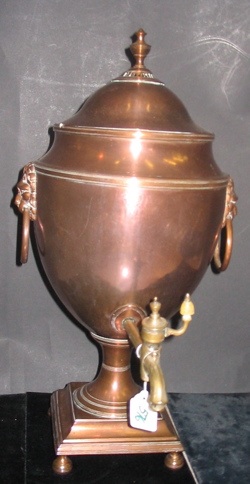 Appraisal: A COPPER PLATED TALL COFFEE URN having lions head mask