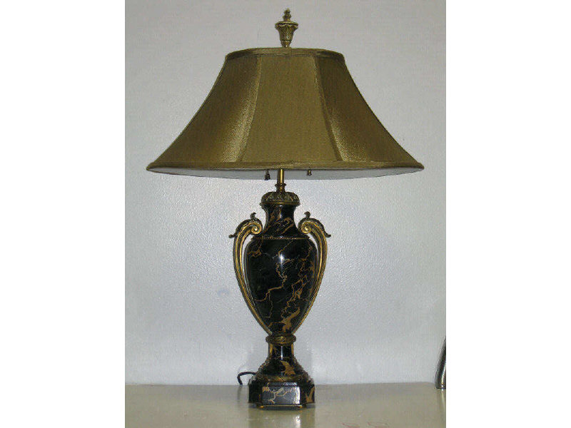 Appraisal: FRENCH ORMOLU MOUNTED MARBLE LAMP Veined black marble footed ovoid