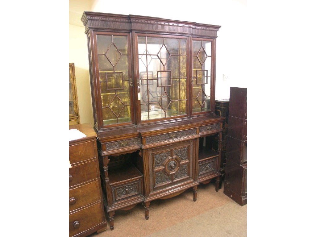 Appraisal: A late Victorian break-fronted mahogany display cabinet upper stage with