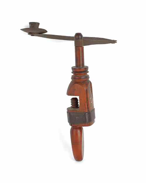 Appraisal: Table mounted candle holder th c with iron extending arm