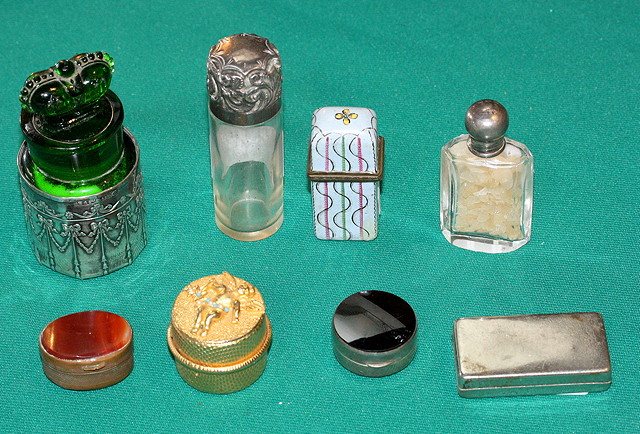 Appraisal: A SILVER MOUNTED GLASS SCENT BOTTLE decorated with ribbons and