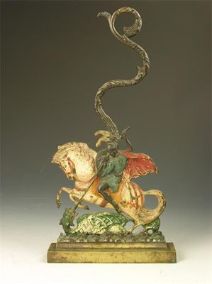 Appraisal: A Victorian brass and polychrome decorated door stop St George