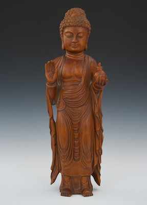 Appraisal: Carved Wood Sculpture of Buddha Chinese Carved red wood gracefully