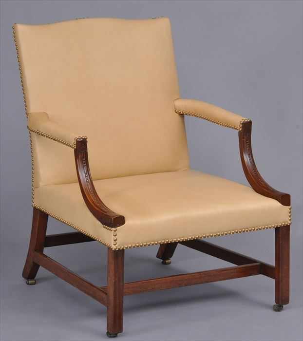 Appraisal: GEORGE III CARVED MAHOGANY LIBRARY ARMCHAIR The raked back with