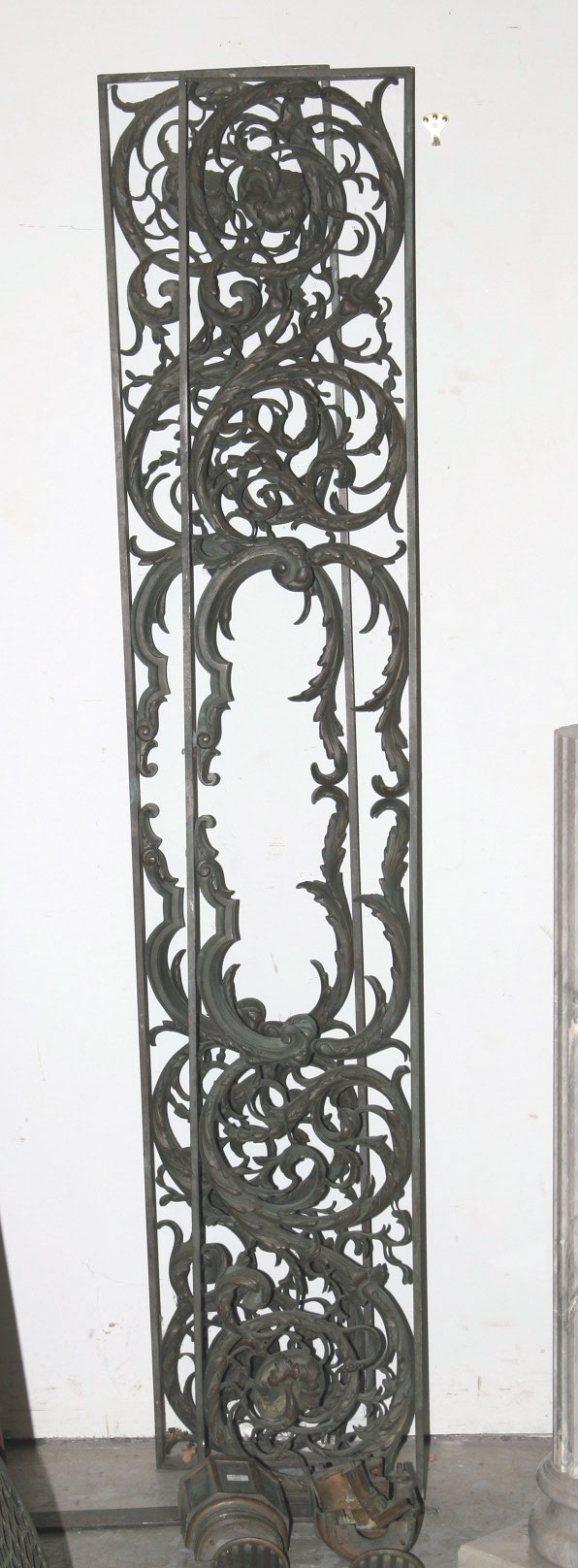 Appraisal: CAST-IRON DOOR SURROUND WITH FLUTED COLUMNS AND SCROLLWORK PANELS Height